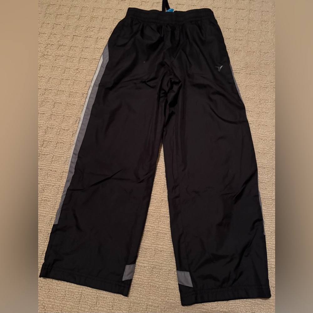 Boys athletic pants in black and gray with inner lining in size medium.